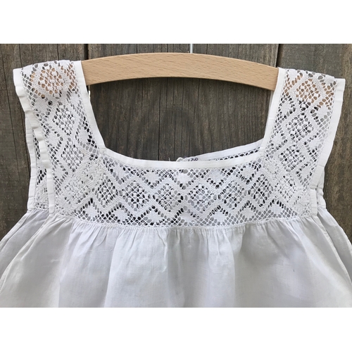 304 - Victorian linen child's pinafore with fine crochet lace yoke, open back with button fastening.