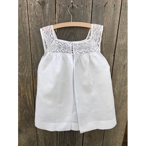 304 - Victorian linen child's pinafore with fine crochet lace yoke, open back with button fastening.