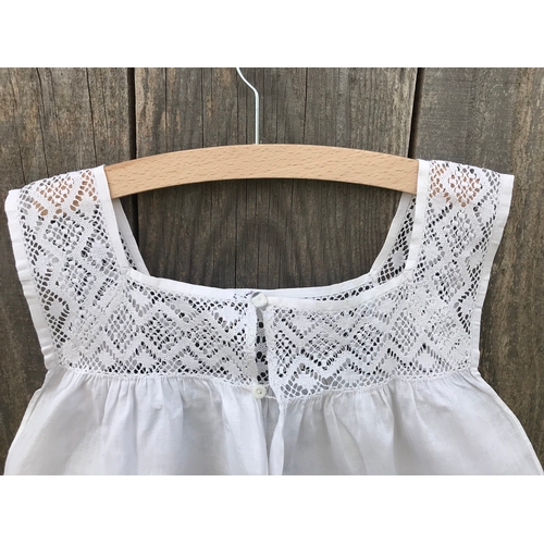 304 - Victorian linen child's pinafore with fine crochet lace yoke, open back with button fastening.