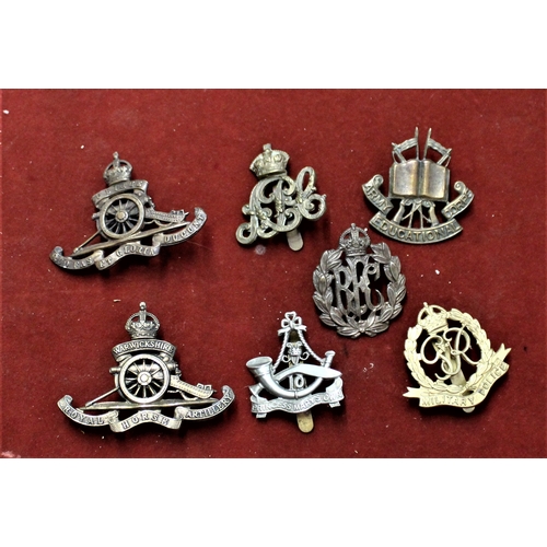 110 - British Military Cap Badges (7) including: Army Educational Corps, Royal Flying Corps, Royal Artille... 