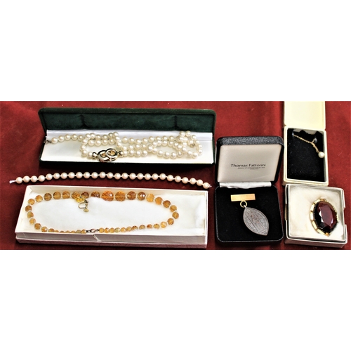 477 - Jewellery and vesta case including: An Amber Coloured Glass Round bead necklace with clear glass spa... 