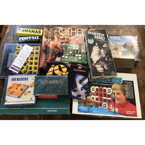 228 - Toys and Games: A box of board games including vintage Othello, Ox Blocks, Master Mind, Word Yahtzee... 