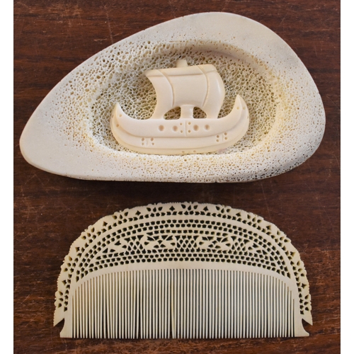 323 - Chinese Bone Comb and paperweight, the comb having cranes caved and the other piece with a ship. A n... 