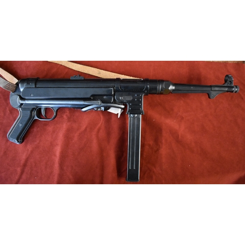 61 - German WWII Replica MP40 with sling, made by Marushin Plug Fire Cartridge Firing weapons and takes 7... 