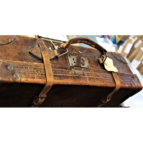 103 - British 1930s Military Leather Suitcase with to straps, initialled K.V.F. Canvas lined inside. Was s... 