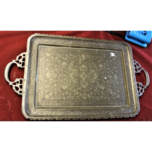 499 - Decorative Brass Tray 21 ins x 12 ins, metal, engraved with floral design patter and Wall Plaque 