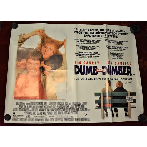 262 - Posters (4) - Walt Disney 'The Sword in the Stone', measurements 100cm x 76cm, 'Dumb & Dumber' starr... 