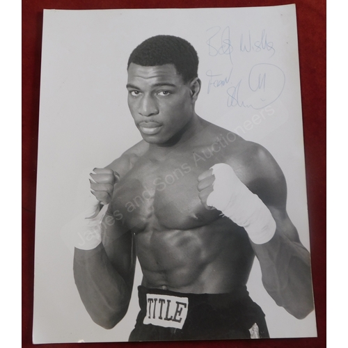 207 - Frank Bruno signed RP photograph 1980s, image after his famous 1983 match against Floyd 