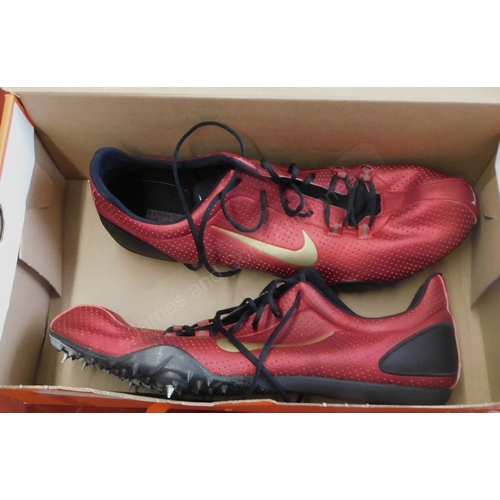 248 - Nike Running Spikes, a pair in red, size 13 and in good condition