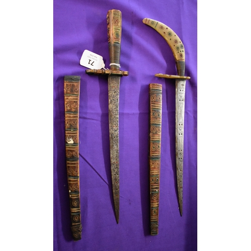 71 - African Tribal daggers, two ornate tribal with etching down the blades with red and green patterns. ... 