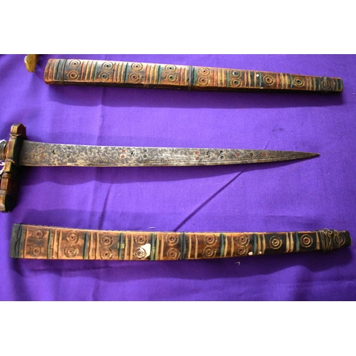 71 - African Tribal daggers, two ornate tribal with etching down the blades with red and green patterns. ... 