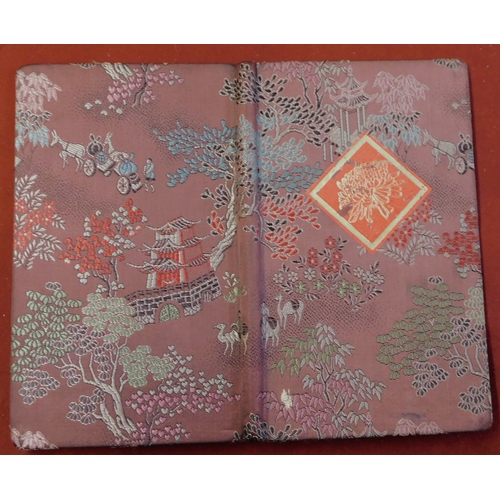 139 - China 1972-74 - Small fabric covered folder with rural embroidered design containing 7 u/m commemora... 