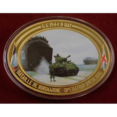 597 - Commemorative coins - (4) coins Operation Overload 1944, coloured war scenes on front, in case, imma... 