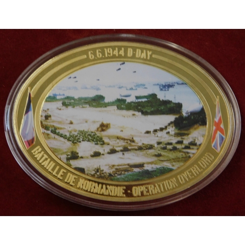 597 - Commemorative coins - (4) coins Operation Overload 1944, coloured war scenes on front, in case, imma... 