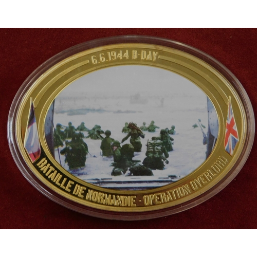 597 - Commemorative coins - (4) coins Operation Overload 1944, coloured war scenes on front, in case, imma... 