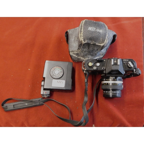 605 - Nikon Camera - Nikkormat FTN AD, with flash unit, with case worn, heavy item with lens, fair to good... 