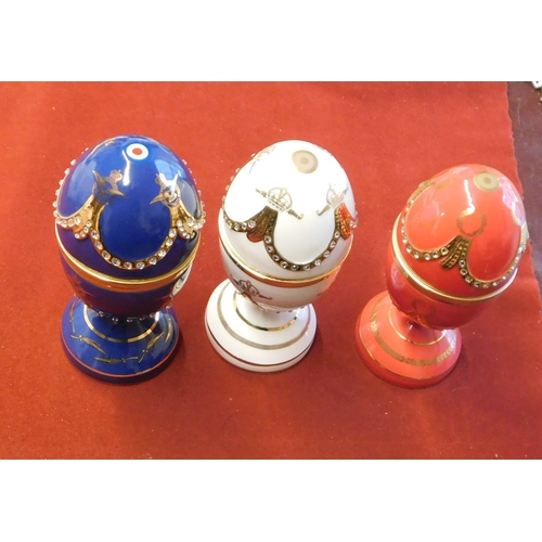 612 - China Faberge Style Eggs on stands. Top lifts to reveal small aircraft, 3 in total, 1 red, 1 white, ... 