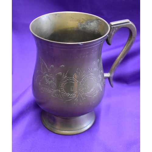 374 - An engraved metal mug presented to a Manchester United player after the match between Shamrock Rover... 