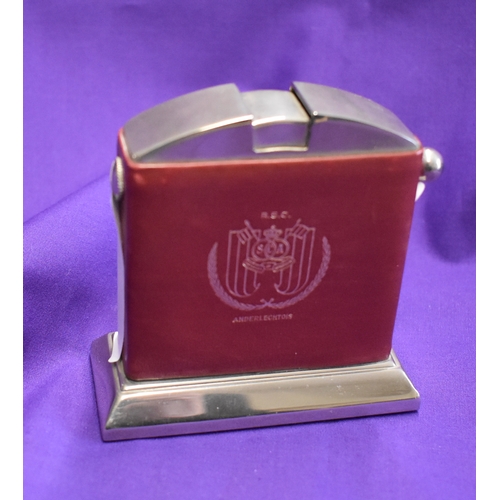 396 - A lighter and alarm clock in an engraved box presented to a Manchester United player following Manch... 