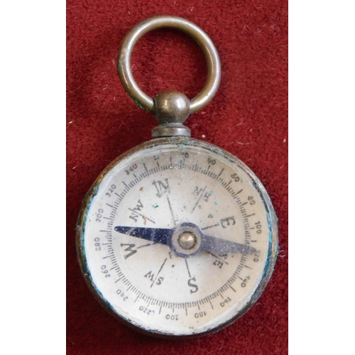 605 - Compass - A small vintage pocket compass in leather case having the gold relief of East Dereham on t... 