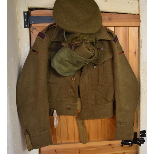 521 - British WWII Battle dress uniform including Jacket, trousers, beret, and puttees, two pairs of wool ... 