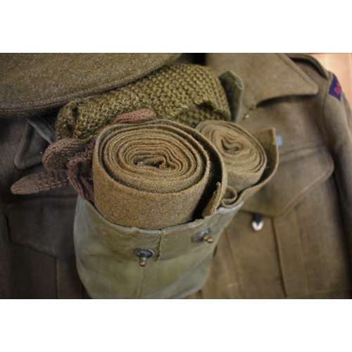 521 - British WWII Battle dress uniform including Jacket, trousers, beret, and puttees, two pairs of wool ... 