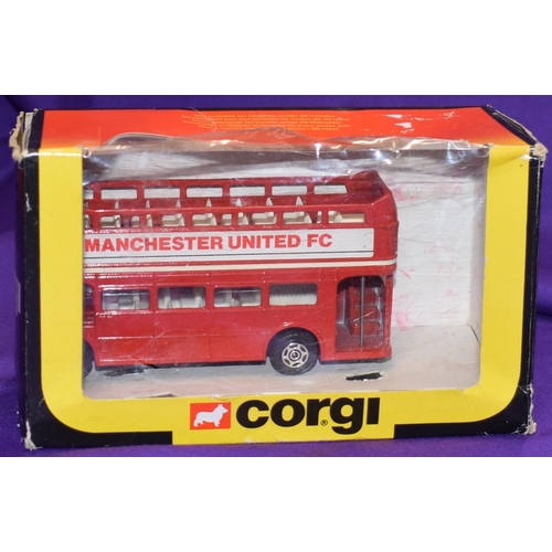 21 - Manchester United Corgi buses x2 one from 1983 and one from 1984. Both in original boxes. Some abras... 