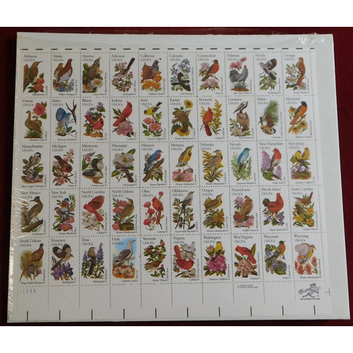 1033 - USA Wildlife 1978-1996 Philatelic package (stained) poste by SG's London to Stowmarket with hardback... 