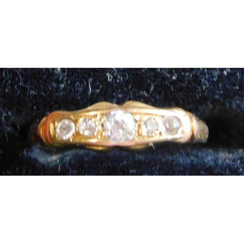 504 - 18ct Gold Ring, thin band, 5 white stones. Total weight 2.5grams approx. in box.