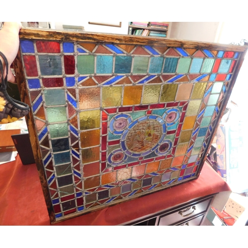 199 - A stained glass window with a central image of a Monk holding a beer mug, wood framed and an excelle... 