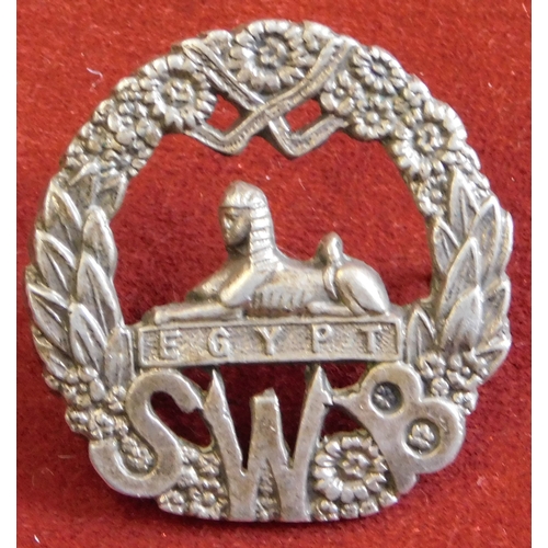 268 - British WWII South Wales Borderers collar badge, a cast copy in white metal with lugs