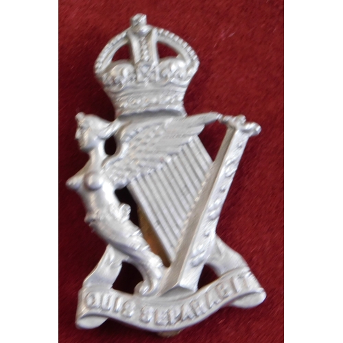 271 - British WWI/II Royal Irish Rifles Regiment Cap Badge, white metal with slider