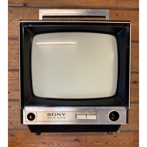 28 - Sony Portable Television Receiver. A Sony 9-90UB portable television receiver, circa 1970. 405 and 6... 