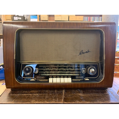 45 - A Vintage Bush Radio Receiver. A vintage Bush VHF 64 AC mains four band AM/FM table radio housed in ... 