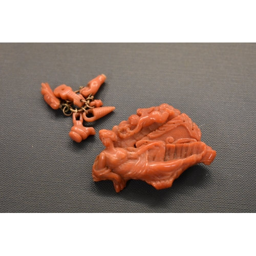 133 - Red Coral Brooch, carved reclining lady with cherub. Missing rear pin. Plus Red Coral and metal clas... 