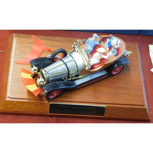 163 - Corgi Chitty Chitty Bang Bang 1992. 25th Anniversary model on mahogany stand. Boxed