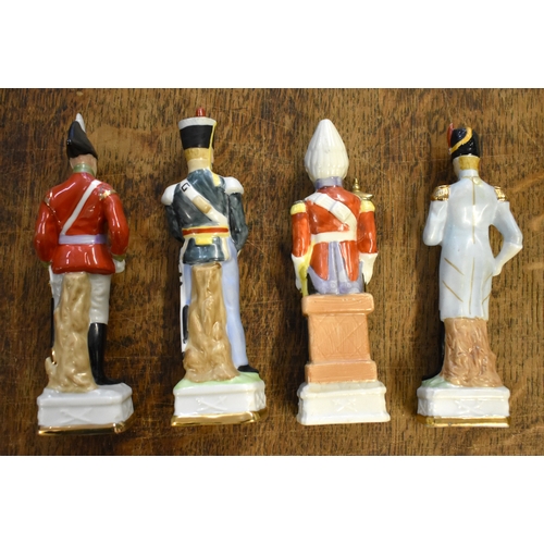 185 - Soldier Statuettes. Collection of bisque / ceramic soldiers (x8). Four soldiers approx 8 inches high... 