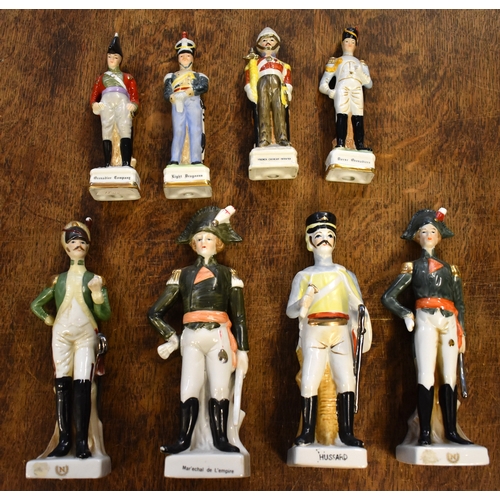 185 - Soldier Statuettes. Collection of bisque / ceramic soldiers (x8). Four soldiers approx 8 inches high... 