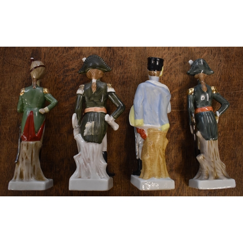 185 - Soldier Statuettes. Collection of bisque / ceramic soldiers (x8). Four soldiers approx 8 inches high... 