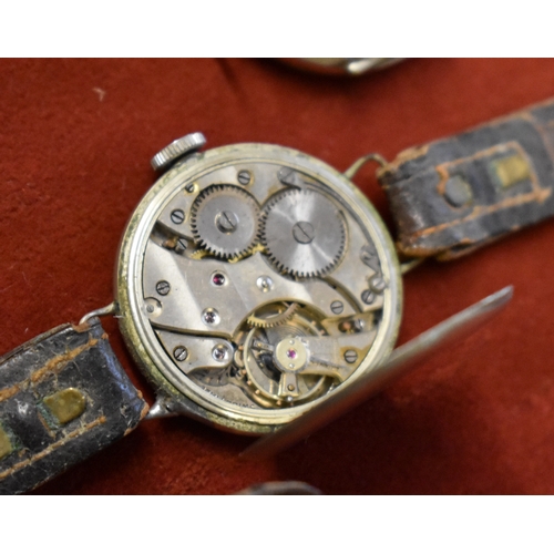 138 - Trench Style Watches x2. 1920's-30's. Swiss made. Wire lug, Nickel cases. Approx 33mm diameter. In n... 