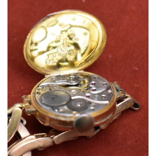 232 - Ladies 9ct Gold Wrist Watch from 1922. Hallmarked case with expandable plated bracelet. Hinged front... 