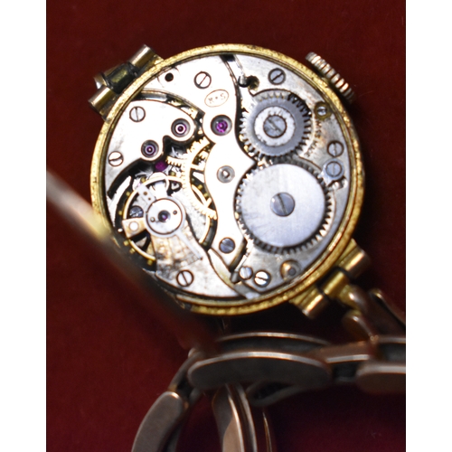 232 - Ladies 9ct Gold Wrist Watch from 1922. Hallmarked case with expandable plated bracelet. Hinged front... 