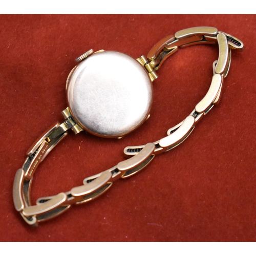 232 - Ladies 9ct Gold Wrist Watch from 1922. Hallmarked case with expandable plated bracelet. Hinged front... 