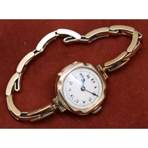 232 - Ladies 9ct Gold Wrist Watch from 1922. Hallmarked case with expandable plated bracelet. Hinged front... 