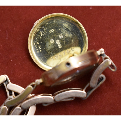 232 - Ladies 9ct Gold Wrist Watch from 1922. Hallmarked case with expandable plated bracelet. Hinged front... 