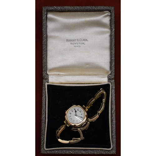 232 - Ladies 9ct Gold Wrist Watch from 1922. Hallmarked case with expandable plated bracelet. Hinged front... 