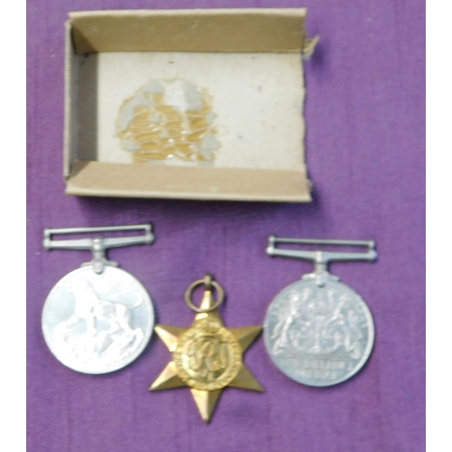 268 - British WWII War Medal Trio including The France and Germany Star, The Defence Medal and The 1939-19... 