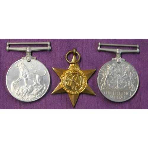 268 - British WWII War Medal Trio including The France and Germany Star, The Defence Medal and The 1939-19... 