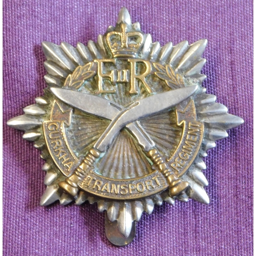 323 - British EIIR Gurkha Transport Regiment cap badge, bi-metal with slider