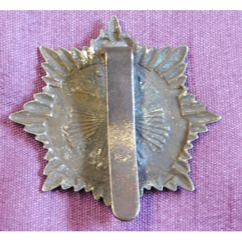 323 - British EIIR Gurkha Transport Regiment cap badge, bi-metal with slider